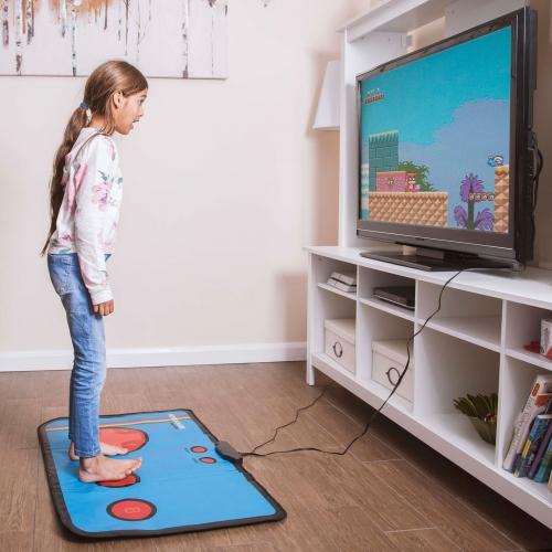 A person playing on a gaming mat